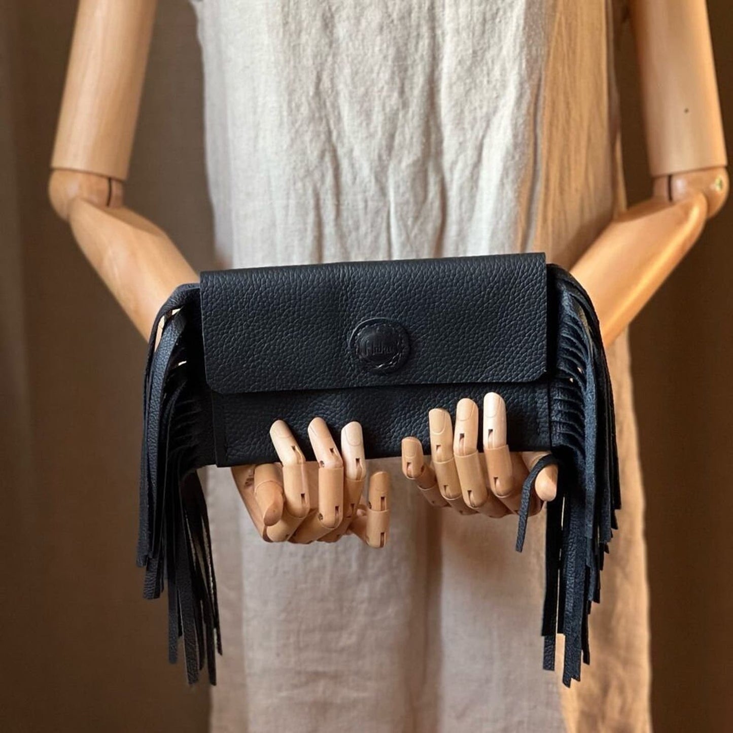 Sleek and Chic: Handcrafted Black Leather Fringe Clutch