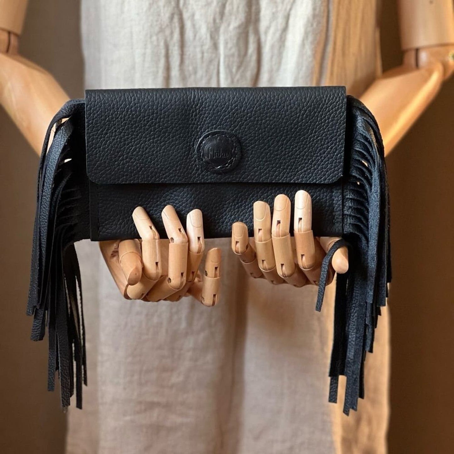 Sleek and Chic: Handcrafted Black Leather Fringe Clutch